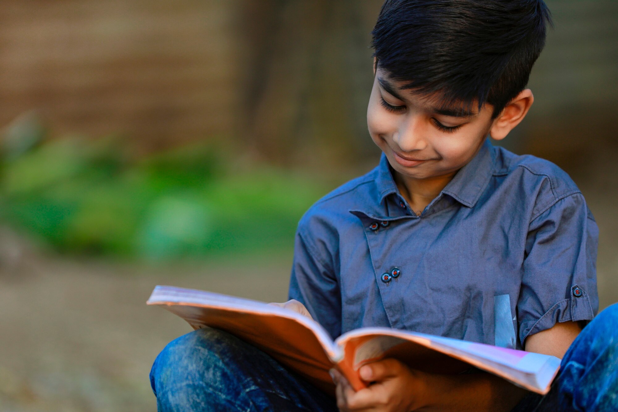 Indian boy reading in rural school library — PASALA Foundation gallery
